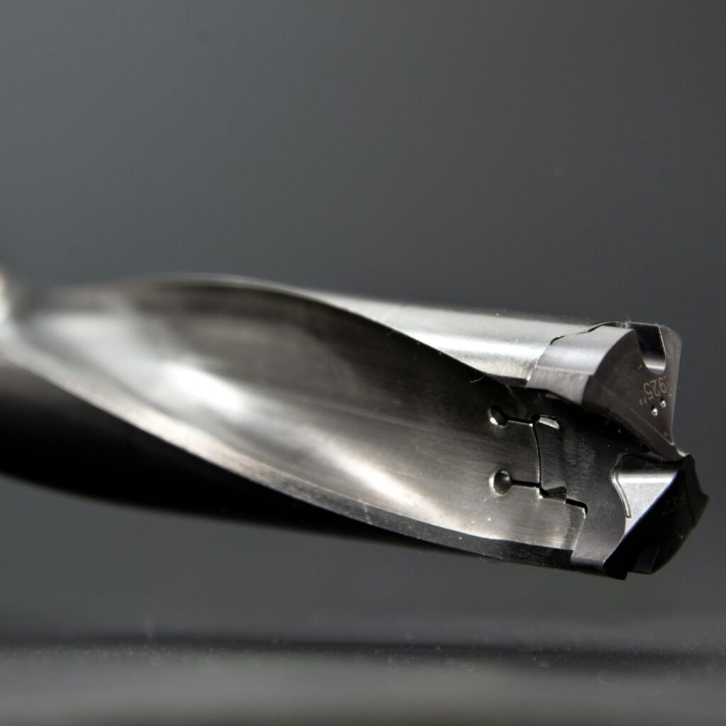 Detailed view of a sharp stainless steel drill bit, ideal for industrial use.