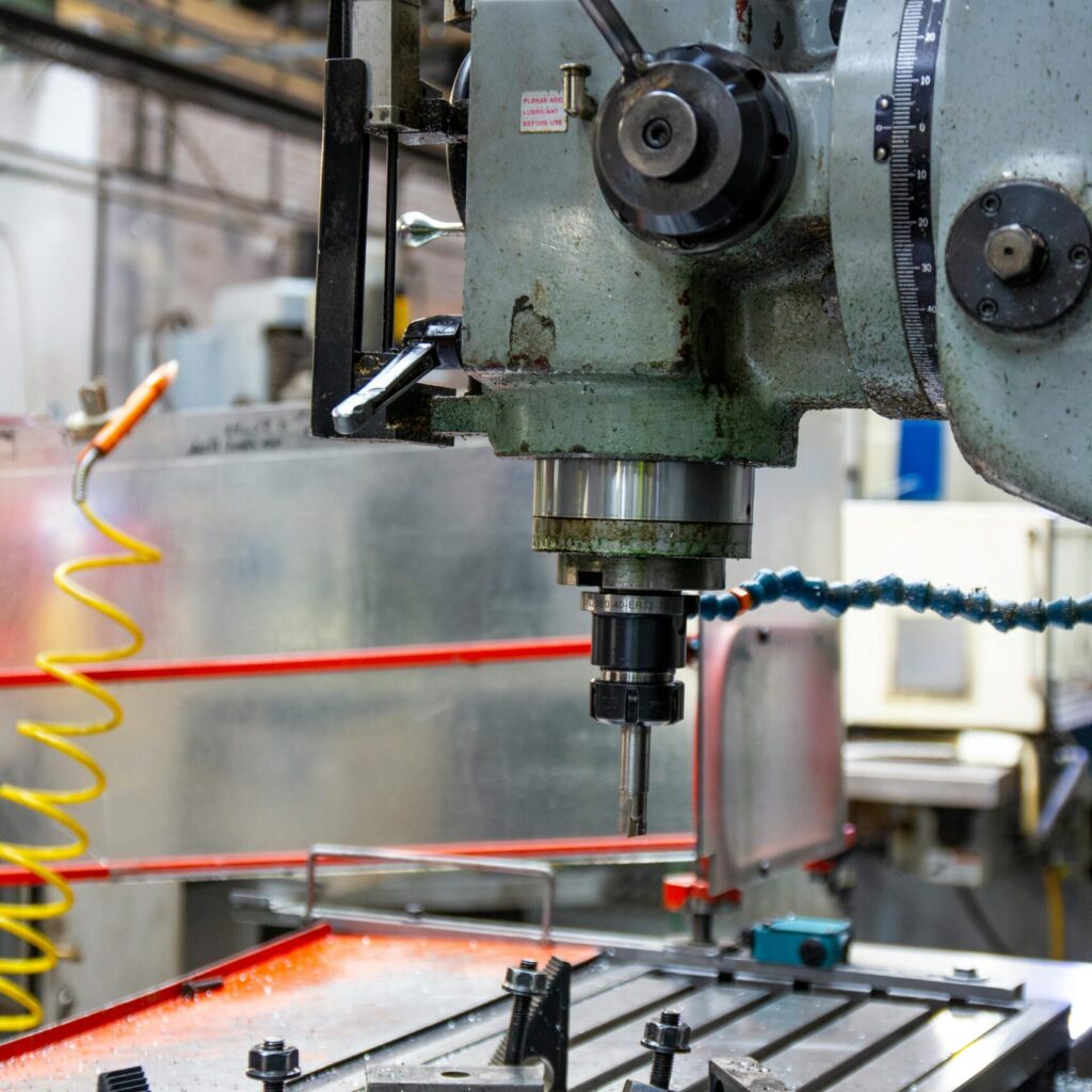 Close-up of a lathe machine in a workshop setting, showcasing precision engineering.